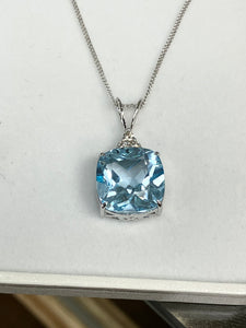 Blue Topaz And Diamond White Gold Pendant