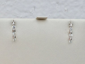14 K White Gold Dangle Diamond Earrings 0.27 Carats.